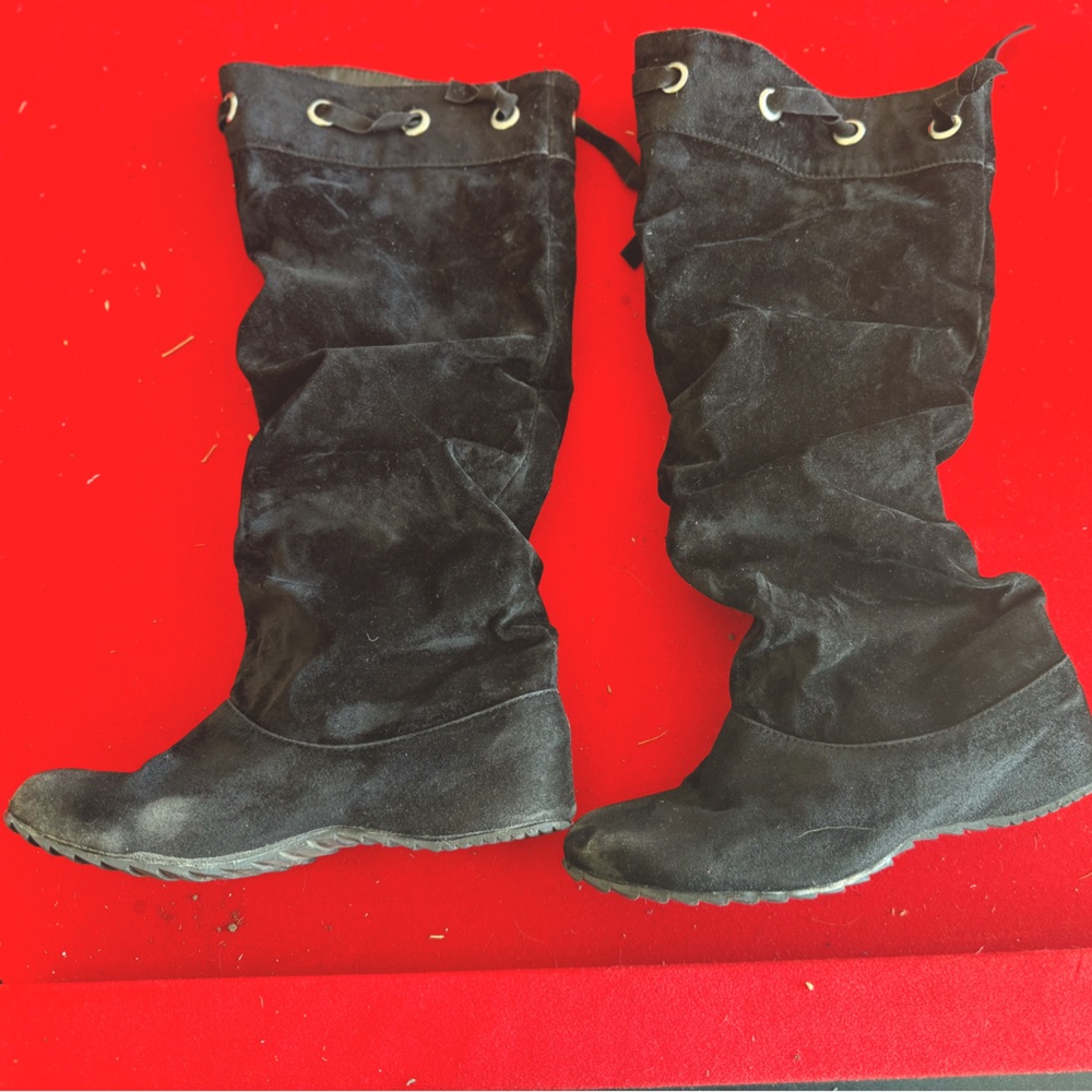 Black knee high boots.